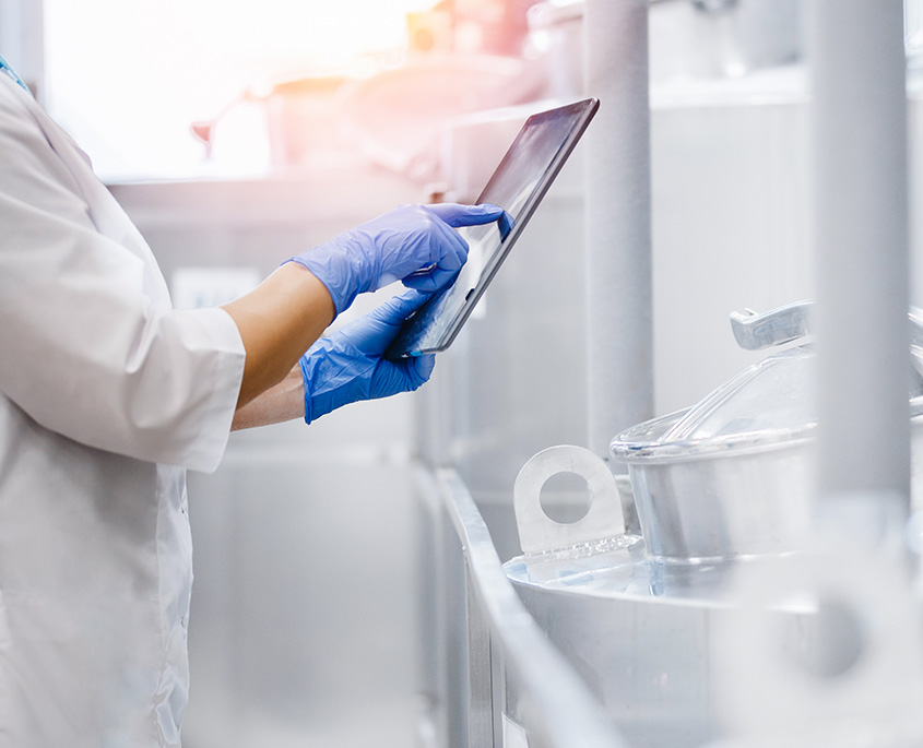 Close up of a female doctor using a tablet