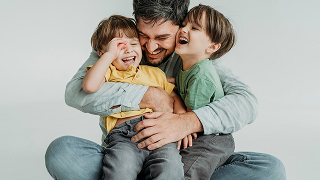 Young dad and children