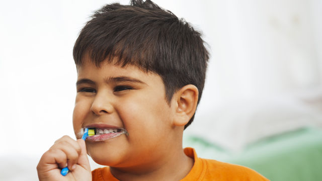 Boy brushing his teeth