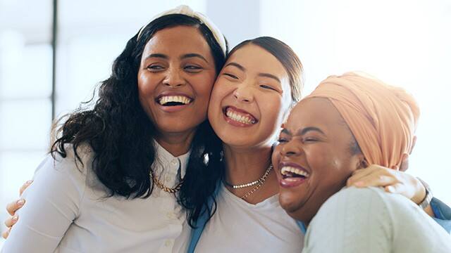 Three young ladys smiling
